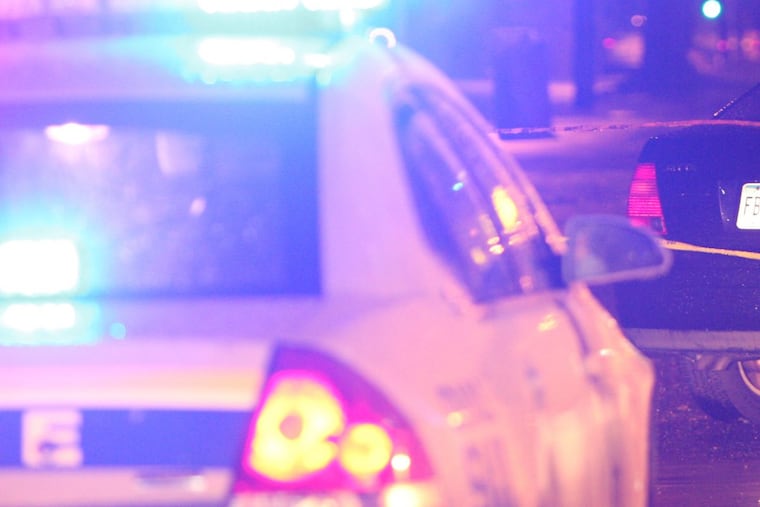 Police scene – Steven M. Falk / Staff Photographer