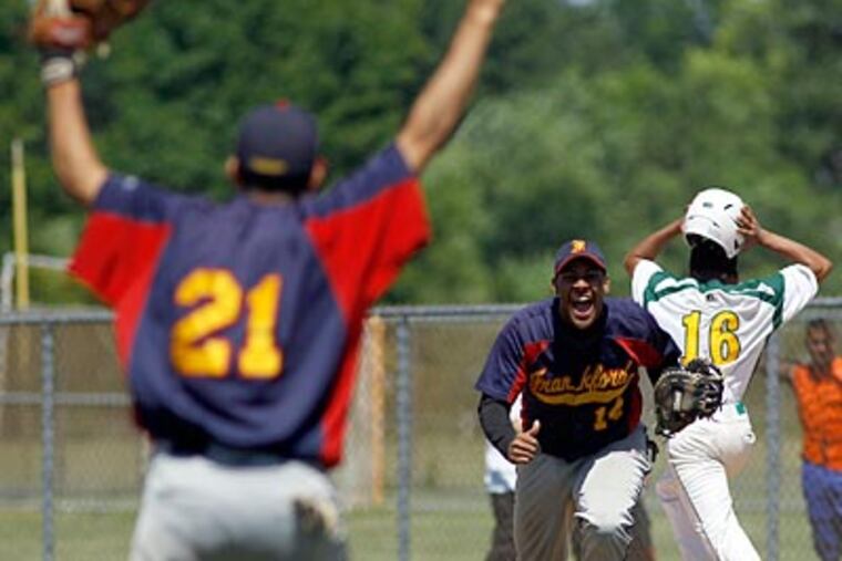 Frankford's Kevin Montero and Brandon Gonzalez celebrate the final out in the Public League championship. (Yong Kim/Staff Photographer)