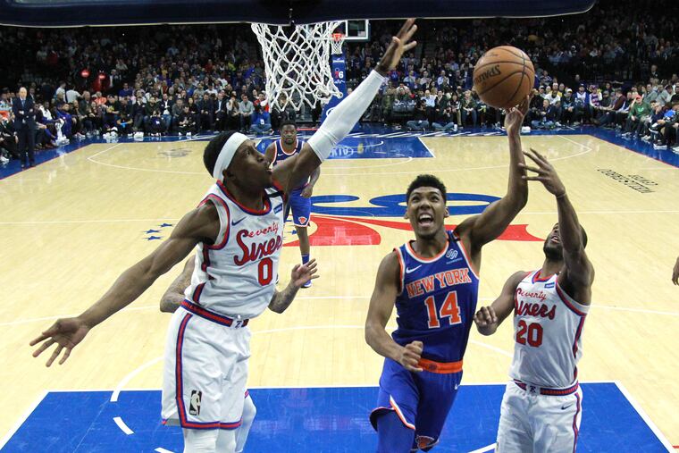 Josh Richardson, left, of the Sixers goes up to block a shot by Allonzo Trier of the Knicks during the 2nd half at the Wells Fargo Center on Feb. 27, 2020.