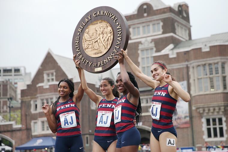 From left, Penn's Nia Akins, Melissa Tanaka, Uchechi Nwogwugwu, and Maddie Villalba celebrate winning the college women's distance medley championship during the 125th annual Penn Relays at Franklin Field on April 25, 2019.