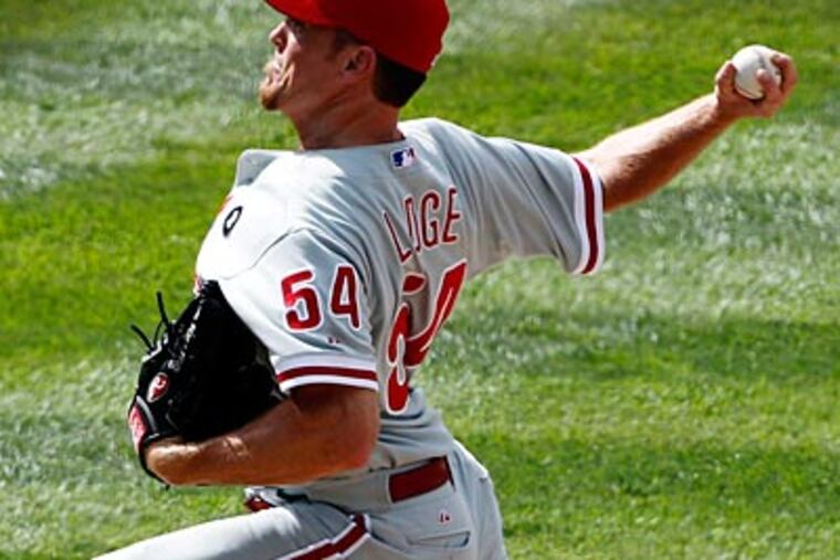 Brad Lidge recorded his first save of the season against the Rockies on Wednesday afternoon at Coors Field. (Ed Andrieski/AP)