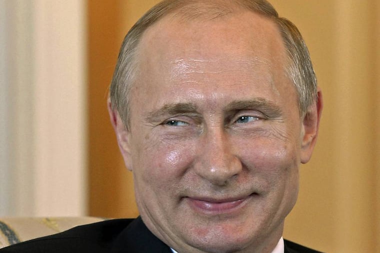 Russian President Vladimir Putin smiles, during his meeting with Kyrgyz President Almazbek Atambayev in the Konstantin Palace outside St. Petersburg, Russia, Monday, March 16, 2015. Putin resurfaced Monday after a 10-day absence from public view, looking healthy. (AP Photo/Sultan Dosaliev, Pool)