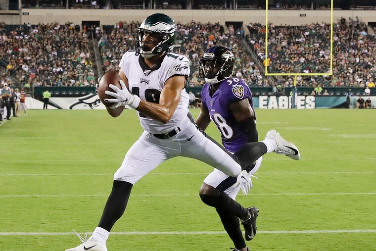 Eagles wide receiver J.J. Arcega-Whiteside catches a third-quarter touchdown past Baltimore Ravens cornerback Stanley Jean-Baptiste in a preseason game Thursday, August 22, 2019 in Philadelphia.