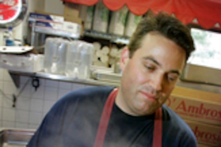 Rick Olivieri at Rick's Philly Steaks at Reading Terminal Market, which is terminating his lease.