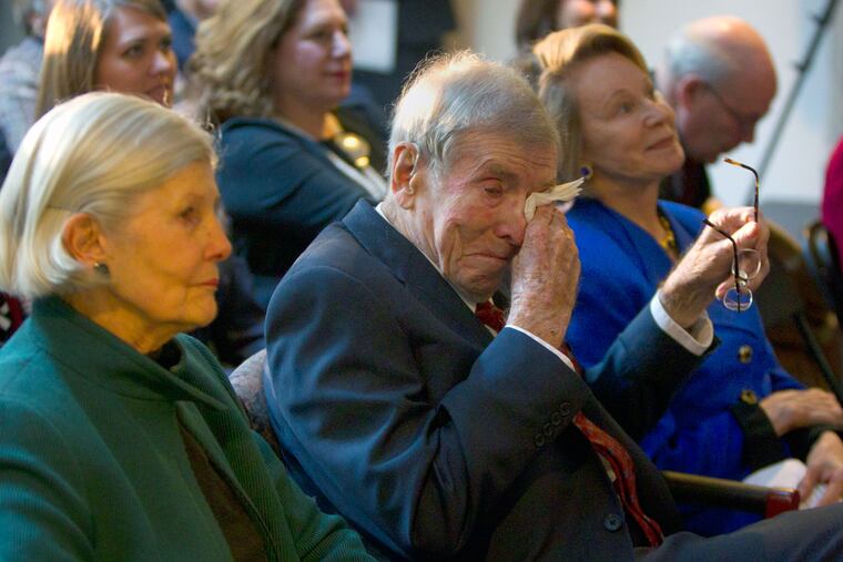 Henry Rowan wipes a tear while with wife Lee and daughter Virginia Rowan Smith at 2002 ceremonies marking the 20th anniversary of his gift.