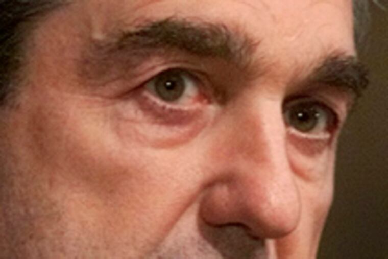 Robert S. Mueller , FBI director, is among past and present officials the suit names.