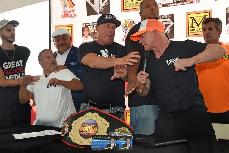 Former World Series Baseball champion Lenny Dykstra (right, orange cap) and internet sensation viral ranter Chris "The Bagel Boss" Morgan (left, white T-shirt) face off during a press conference at the Original Tony Luke's on East Oregon Avenue August 22, 2019. The two will step into the Celebrity Boxing Ring and fight September 28 at The Showboat Hotel in Atlantic City.