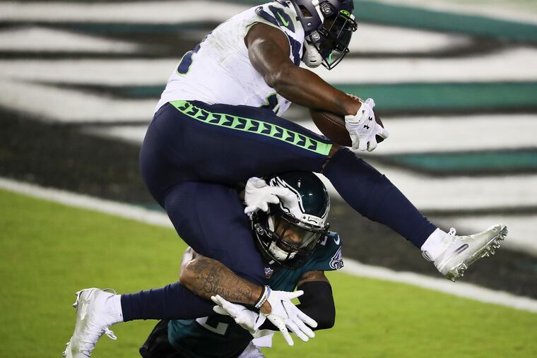 Seattle Seahawks wide receiver DK Metcalf, shown leaping over Darius Slay, was a real handful for the Eagles Monday night.