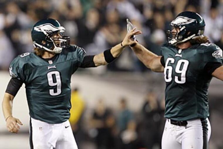 Eagles quarterback Nick Foles celebrates a touchdown pass with offensive lineman Evan Mathis. (Yong Kim/Staff Photographer)