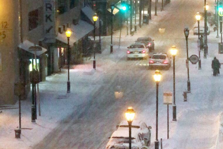 A snowy view looking south on 8th Street from Market just before 6 p.m. on Feb. 21, 2015. ( ELIZABETH ROBERTSON / Staff Photographer )