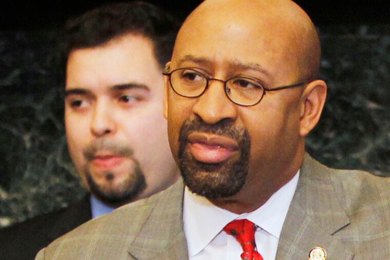Philadelphia Mayor Michael Nutter held a press conference in his reception room, city hall on Thursday, March 7, 2013 to announce his establishment of Office of Immigrant and Multi-Cultural Affairs. Appointed to lead the office are Jennifer Rodriguez, Executive Director (right) and Fernando Trevi–o-Martinez, Deputy Director (left background). ( ALEJANDRO A. ALVAREZ / STAFF PHOTOGRAPHER )