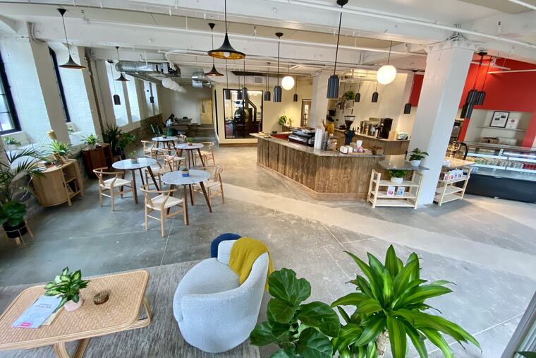 Càphê Roasters, at J Street and Kensington Avenue, has cozy seating. Its roaster is at rear, behind glass in a separate room.