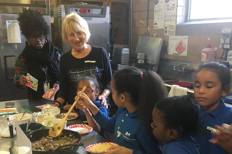 Sashai Roberts and Judi Levine look on as Gigi Torres, Katelyn Moreno, Lashay Pearson and Hailey Ramos, and serve themselves steak tacos at MCGraw Elementary School in Camden.