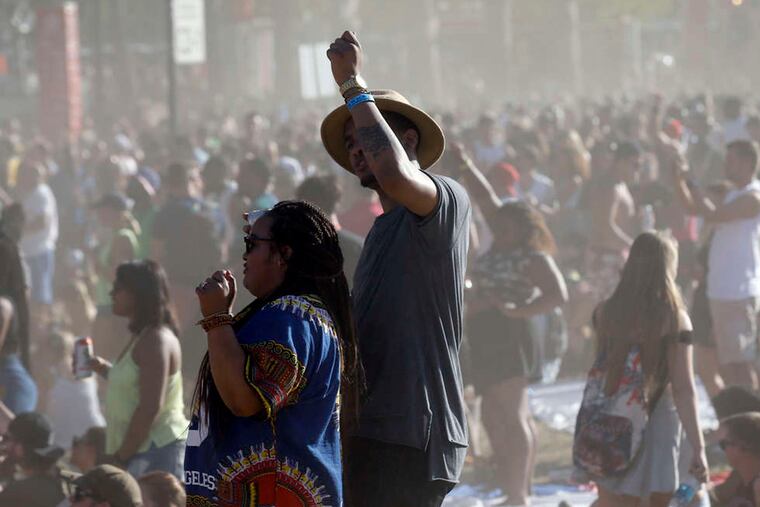 Concert-goers dance while the Future performs at the Liberty Stage during day two of Made In America along the Benjamin Franklin Parkway on Sunday, September 6, 2015.