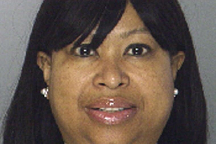 Arrested: Lt. Aisha Perry (left), Officer George Suarez.