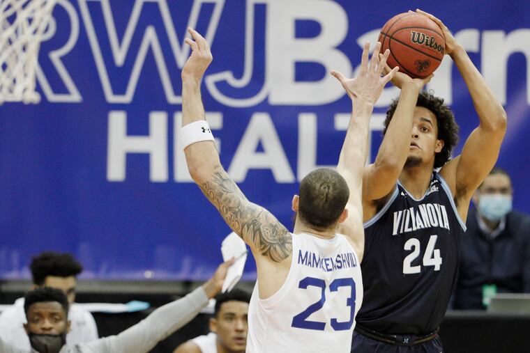 Villanova’s Jeremiah Robinson-Earl (24) shoots over Seton Hall’s Sandro Mamukelashvili on Jan. 30.
