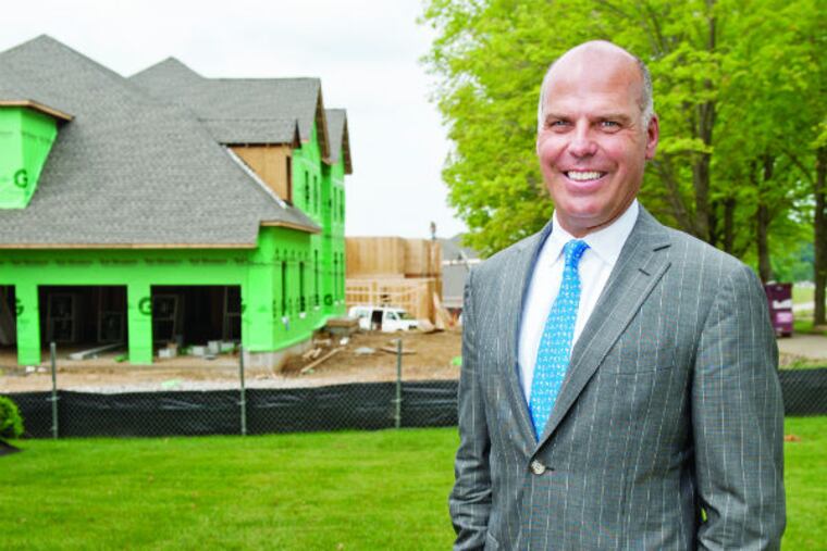Doug Yearly, CEO of Toll Brothers, stands outside the Weatherstone model home in Newtown Square, Pa. on Tuesday, June 16, 2015. (MICHAEL PRONZATO / Staff Photographer)