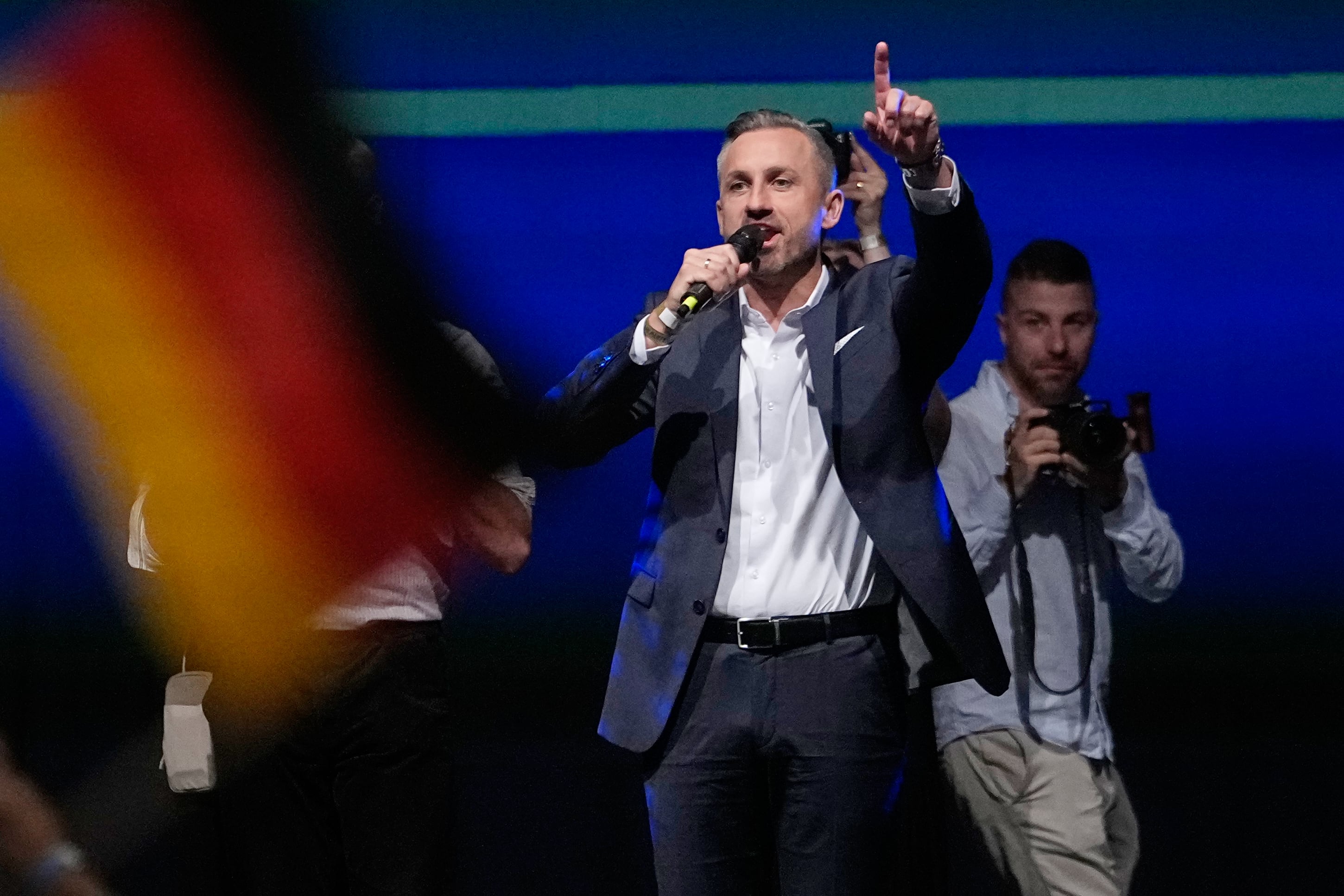 German chancellor faces tough times after first far-right party's state election win since Nazi era