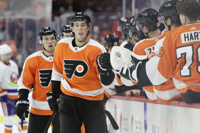 Rookie center Mikhail Vorobyev celebrates his first-period goal with his teammates in a preseason game against the Islanders.