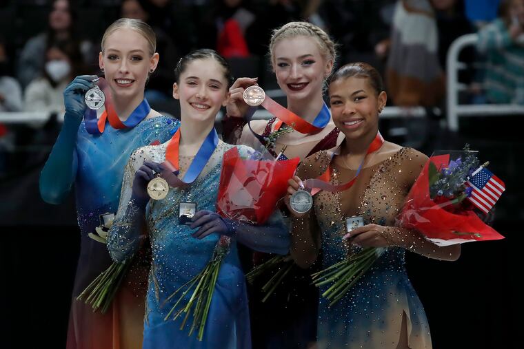 Isabeau Levito (second from left), Bradie Tennell, Amber Glenn, and Starr Andrews pose with their medals after the U.S. Figure Skating Championships in San Jose, Calif.