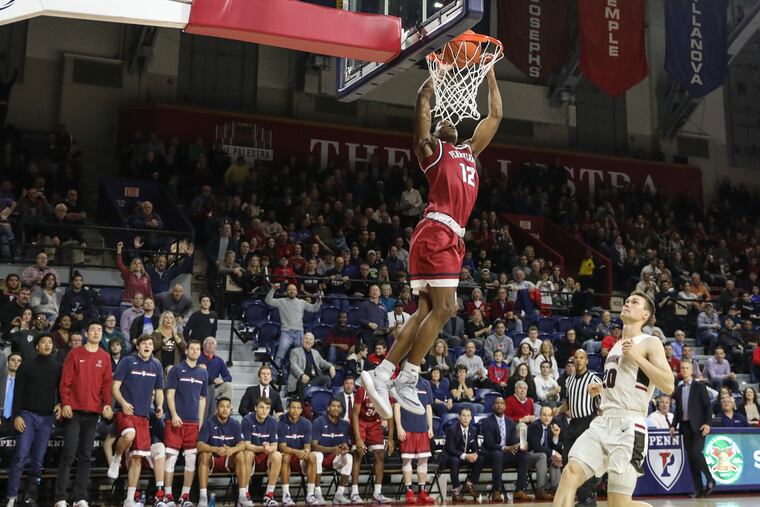 Penn's Devon Goodman throws down a slam dunk during one of the Quakers' second-half runs in their win over Brown on Saturday at the Palestra.