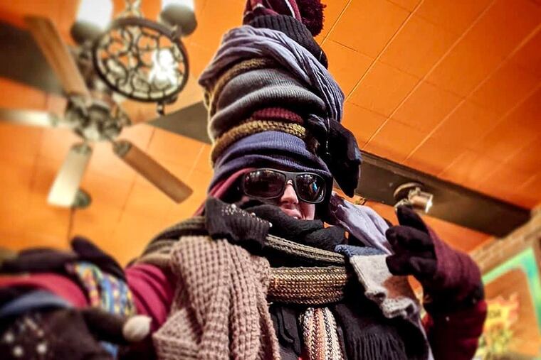 Skylar Kley models clothing from Fergie's Pub's lost and found that was sent to a charity.