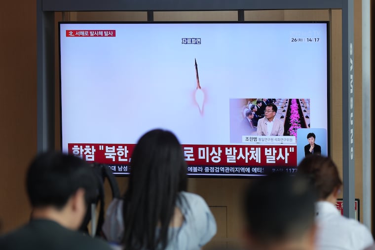 A TV screen shows a reporting of North Korea's unidentified projectile with file footage during a news program at the Seoul Railway Station in Seoul, South Korea, Tuesday, May 26, 2026.