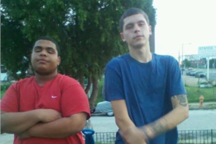 A photo on the Facebook page of Freddie Henriquez (left). The Philadelphia District Attorney's Office says Henriquez threatened a witness in the post, and Facebook has refused to remove the photo.