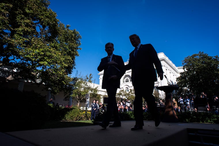 President Donald Trump walks with Federal Reserve Board member Jerome H. Powell (left) at the White House after he announced him as his nominee for chair of the Federal Reserve in November 2017.