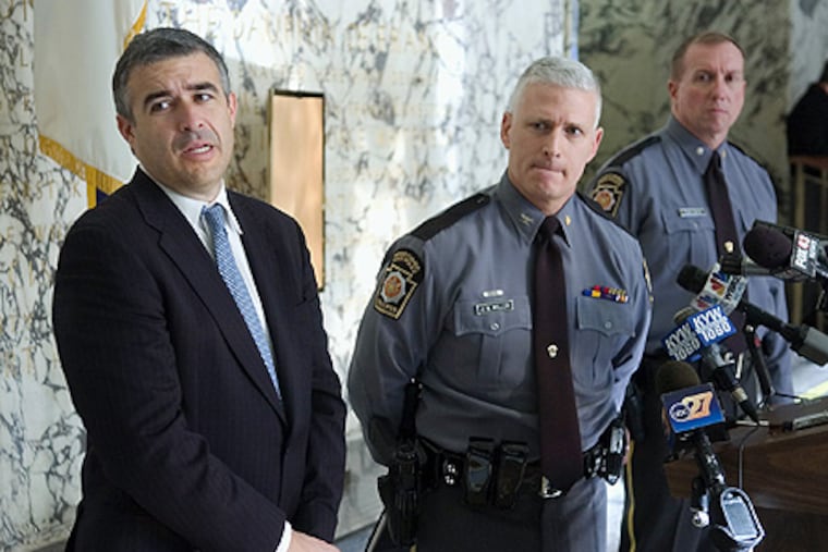 Dauphin County District Attorney Edward Marsico (left) and Pennsylvania State Police Commissioner Colonel Jeffery Miller answering reporters' questions at a news conference today announcing the filing of charges against Louis DeNaples.