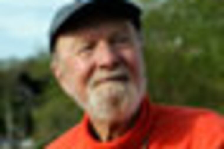 **FILE**Pete Seeger plays his banjo May 5, 2006 in Beacon, N.Y. The 88-year-old banjo-picker has written a song about Joe Stalin, the late Soviet leader that is as scathing as any tune in the folk legend's long career. He told The Associated Press on Friday, Aug. 31, 2007, that the long-gestating song was finally finished this year. (AP Photo/Frank Franklin II)