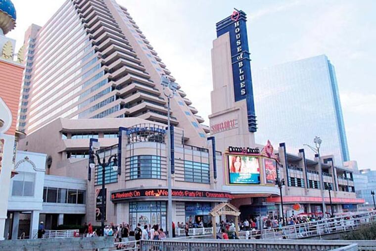 This July 20, 2013 photo shows a slanted hotel tower, left, of the Showboat Casino Hotel in Atlantic City. The casino may close, according to the union chief. (AP Photo/Wayne Parry)