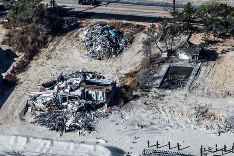 A year later after Hurricane Sandy, a pile of debris still rests where presumably a home once stood on the 1200 block of Ocean Boulevard in Mantoloking. (Colin Kerrigan / Philly.com)
