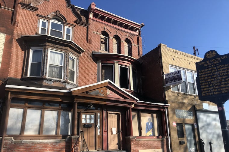 A developer has purchased 1509 N. 33rd Street, the house next to the one where jazz musician John Coltrane lived during his most productive period, and has requested permission to demolish building., which includes three arched windows on the third floor.