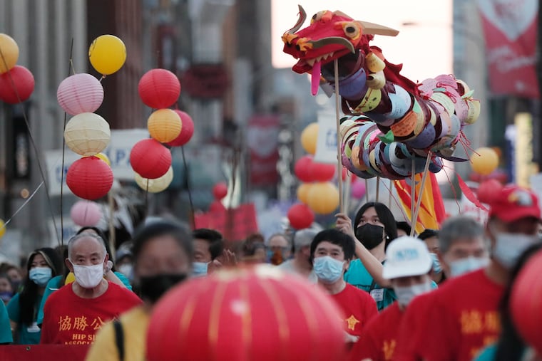 The parade celebrating the 26th Chinatown Mid-Autumn Festival make sits way down Arch Street in Philadelphia on Saturday.