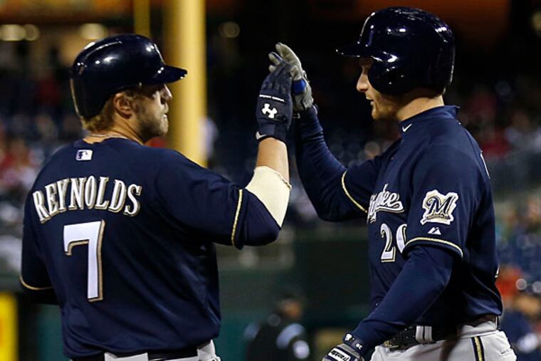 The Brewers' Mark Reynolds celebrates his two-run homer. (Yong Kim/Staff Photographer)
