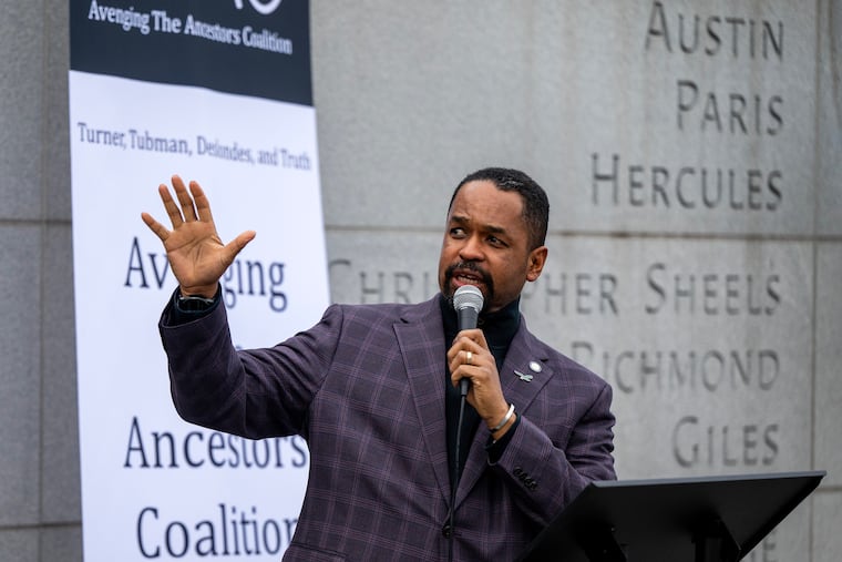 State Sen. Sharif Street speaks in December in front of the engraved names of nine enslaved people who lived and worked at President George Washington's home.