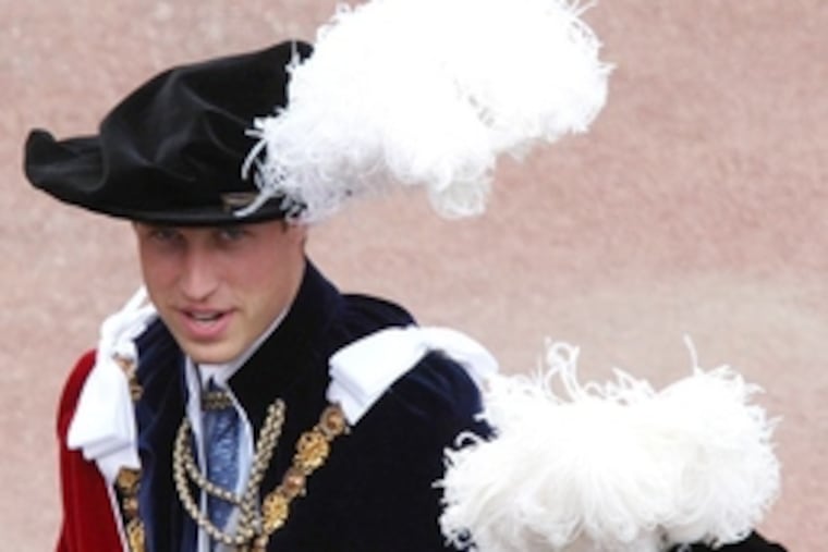 Prince William with his father, Prince Charles, during yesterday's Garter ceremony at Windsor. He was formally appointed a Royal Knight Companion, the most senior British order of chivalry.