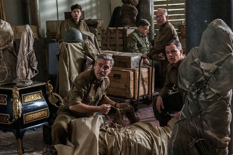 George Clooney and (from left) Dimitri Leonidas, John Goodman, Bob Balaban, and Matt Damon as a squad of curators, architects, and sculptors racing to save art treasures before Nazis can destroy them.