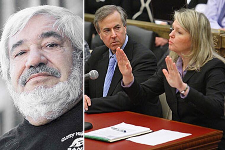 Linda Wilson, right, chief operating officer of Aria Health, answers a question put to her by the Committee on Public Health about the death of Joaquin Rivera, left, in the emergency room of Aria's Frankford Hospital. Rivera was robbed after he died while waiting for treatment last year. (Michael Bryant / Staff Photographer)