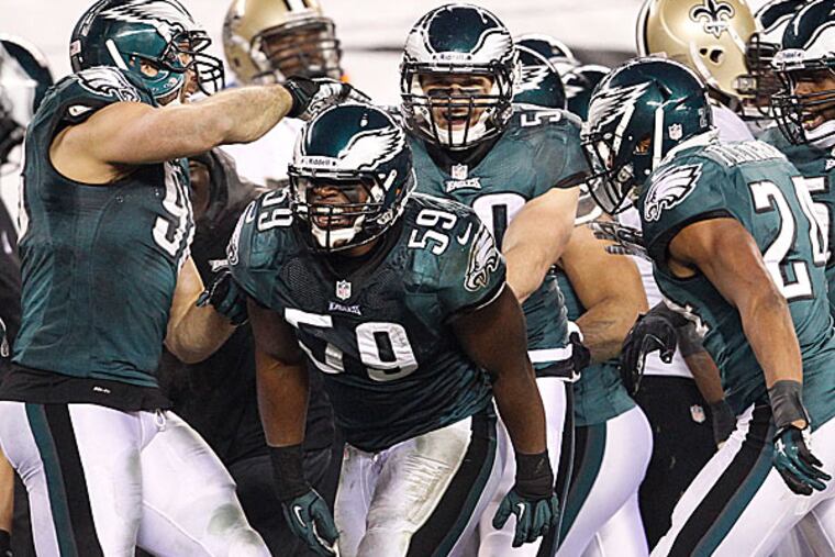 Eagles linebacker DeMeco Ryans is congratulated by teammates Connor Barwin. (Ron Cortes/Staff Photographer)