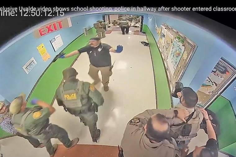 In this photo from surveillance video provided by the Uvalde Consolidated Independent School District via the Austin American-Statesman, authorities respond to the shooting at Robb Elementary School in Uvalde, Texas, on May 24, 2022. Nearly 400 law enforcement officials rushed to the mass shooting that left 21 people dead at the elementary school but “systemic failures” created a chaotic scene that lasted more than an hour before the gunman was finally confronted and killed, according to a report from investigators released Sunday, July 17, 2022.