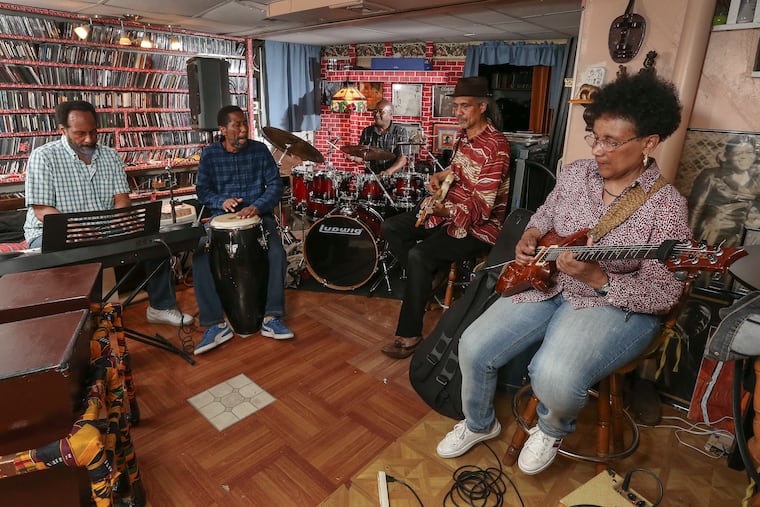 Practicing in the Mount Airy basement of Dwight James on June 3, Sounds of Liberation will reunite for their first show in decades. (L-R) Billy Mills, Lamont Smith, Dwight James, Charles Veasley, and Monnette Sudler.