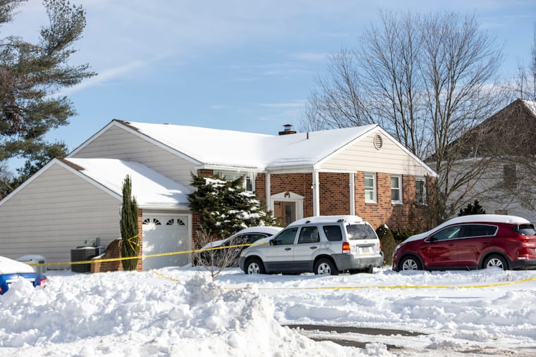 Bucks County detectives and police at the home where three people died in Northampton Township on Monday.