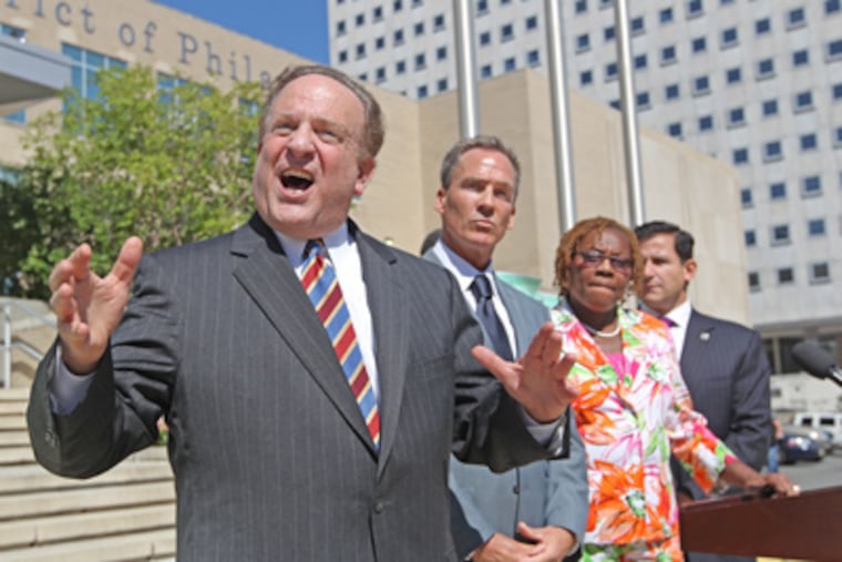 State Sen. Andy Dinniman speaks at a news conference outside
School District headquarters. Listening are (from left) State Sens.
Mike Stack, LeAnna Washington, and Larry Farnese. (Michael Bryant / Staff Photographer)