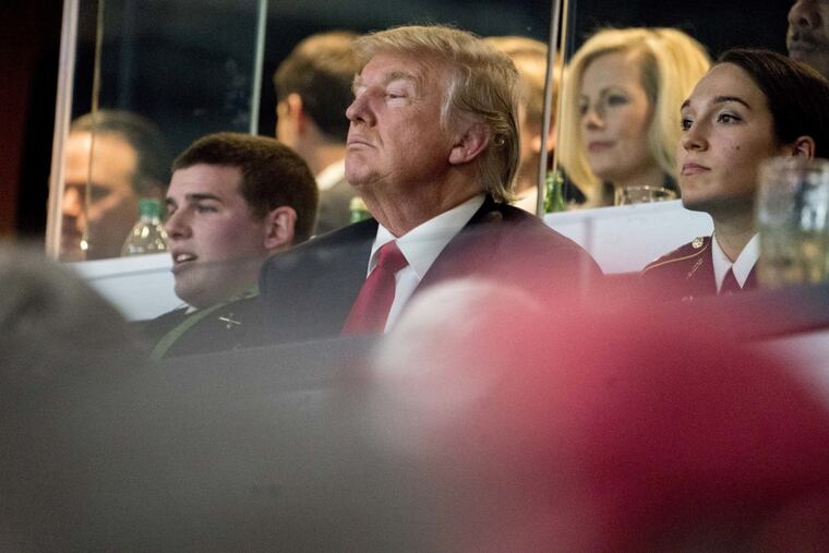 President Donald Trump watches the NCAA National Championship game at Mercedes-Benz Stadium, Monday, Jan. 8, 2018, in Atlanta, between Alabama and Georgia.