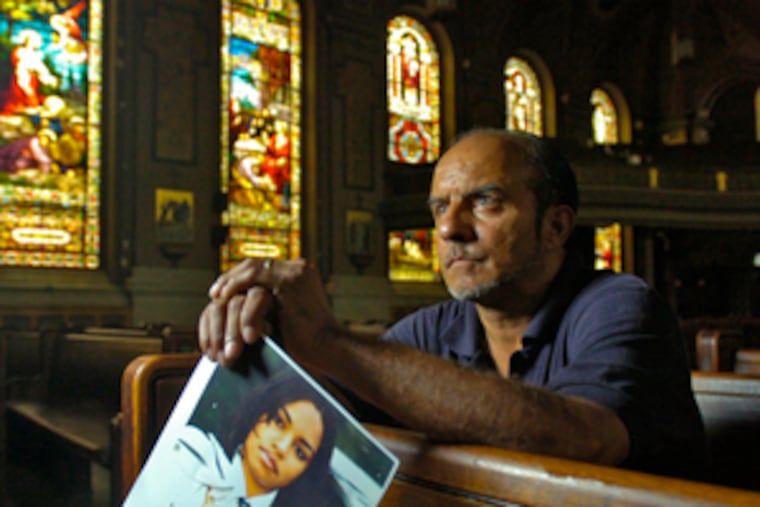 Melvin Figueroa hopes to start a foundation to help find missing people like his murdered daughter, whose picture he holds.