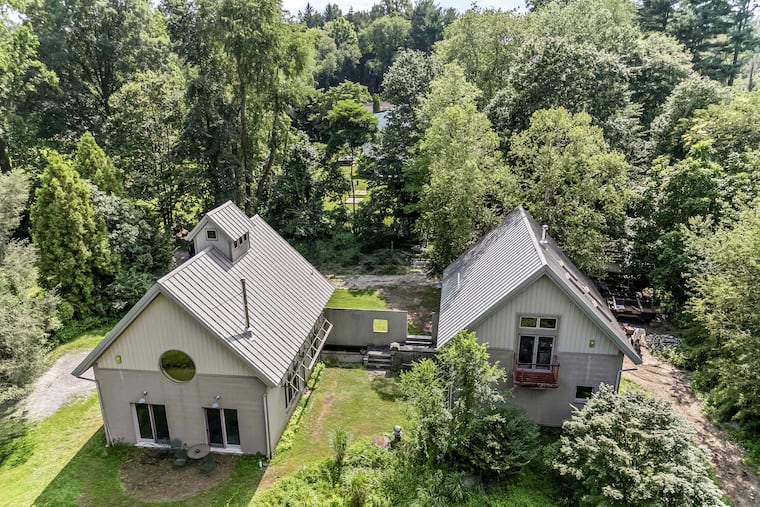 The house is on the left and the studio on the right.