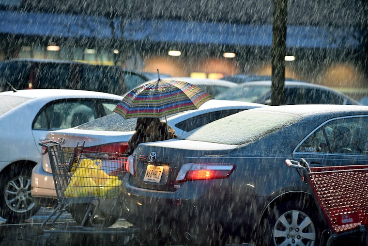 A shopper unloads their grocery cart as snow begins to fall at the Shoprite on Rt. 70 in Cherry Hill March 3, 2019. Snow was forecast to fall at the rate of an inch or two per hour depending on the location according to the National Weather Service.