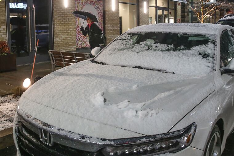 Snow covered cars at the Town Center in King of Prussia on Tuesday. This has been the year of the incremental snows. STEVEN M. FALK / Staff Photographer
